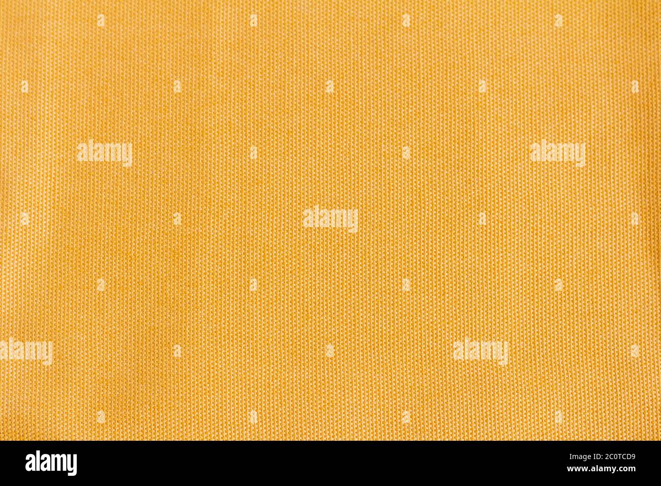 Dichte Baumwollgewebe Textur von gelb oder Senf Farbe.Stoff Textur für Design und Dekoration. Stockfoto