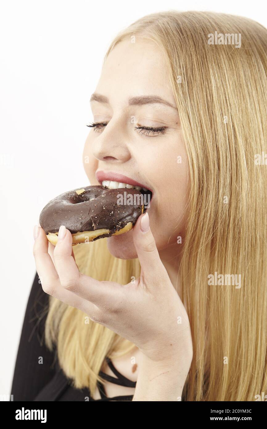 Sie liebt den Donut Stockfoto