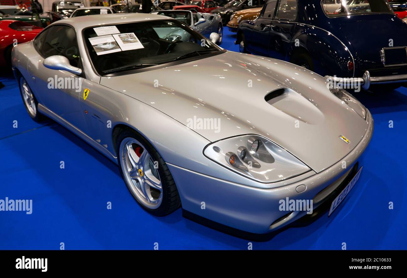 Dreiviertel Vorderansicht eines Silver, 2003, Ferrari 575M Fiorano auf dem Coys Auction Area der London Classic Car Show 2019 Stockfoto