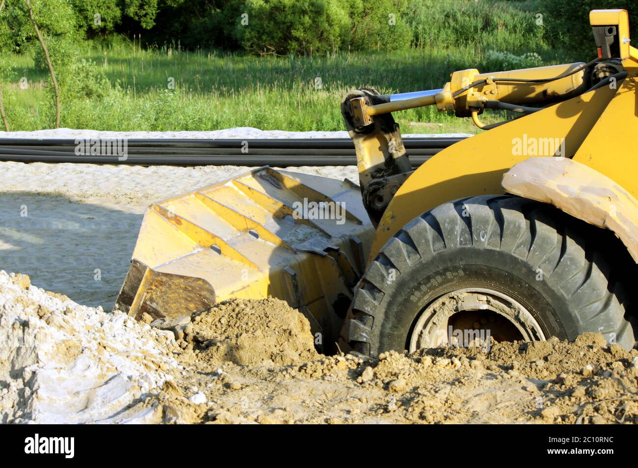 Rad Maschinenfabrik Planierraupe für Schaufeln Sand am Eathmoving in Baustelle Stockfoto