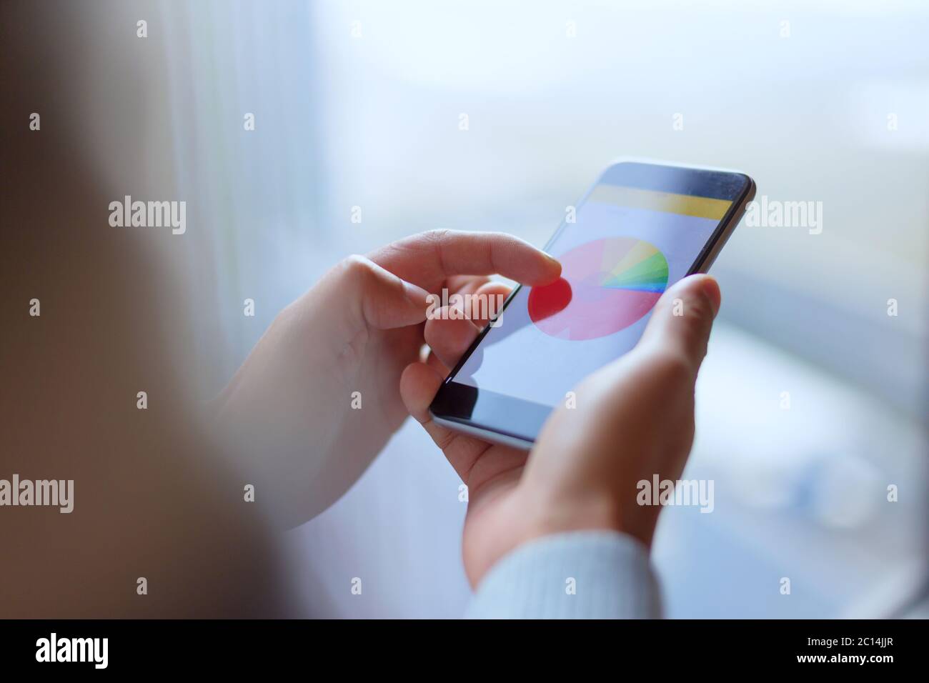Mobiltelefon mit Börse Stockfoto
