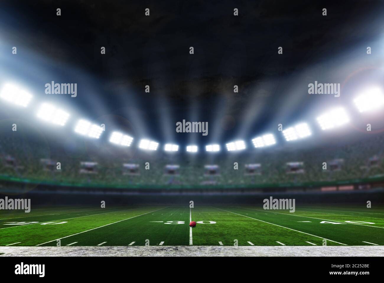 American Football Stadium mit Lichtern im Hintergrund Stockfoto