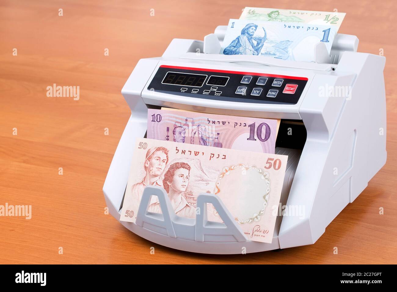 Altes Geld aus Israel in einer zählmaschine Stockfoto