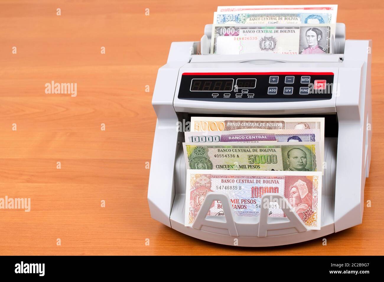 Alte bolivianische Boliviano in einer zählmaschine Stockfoto