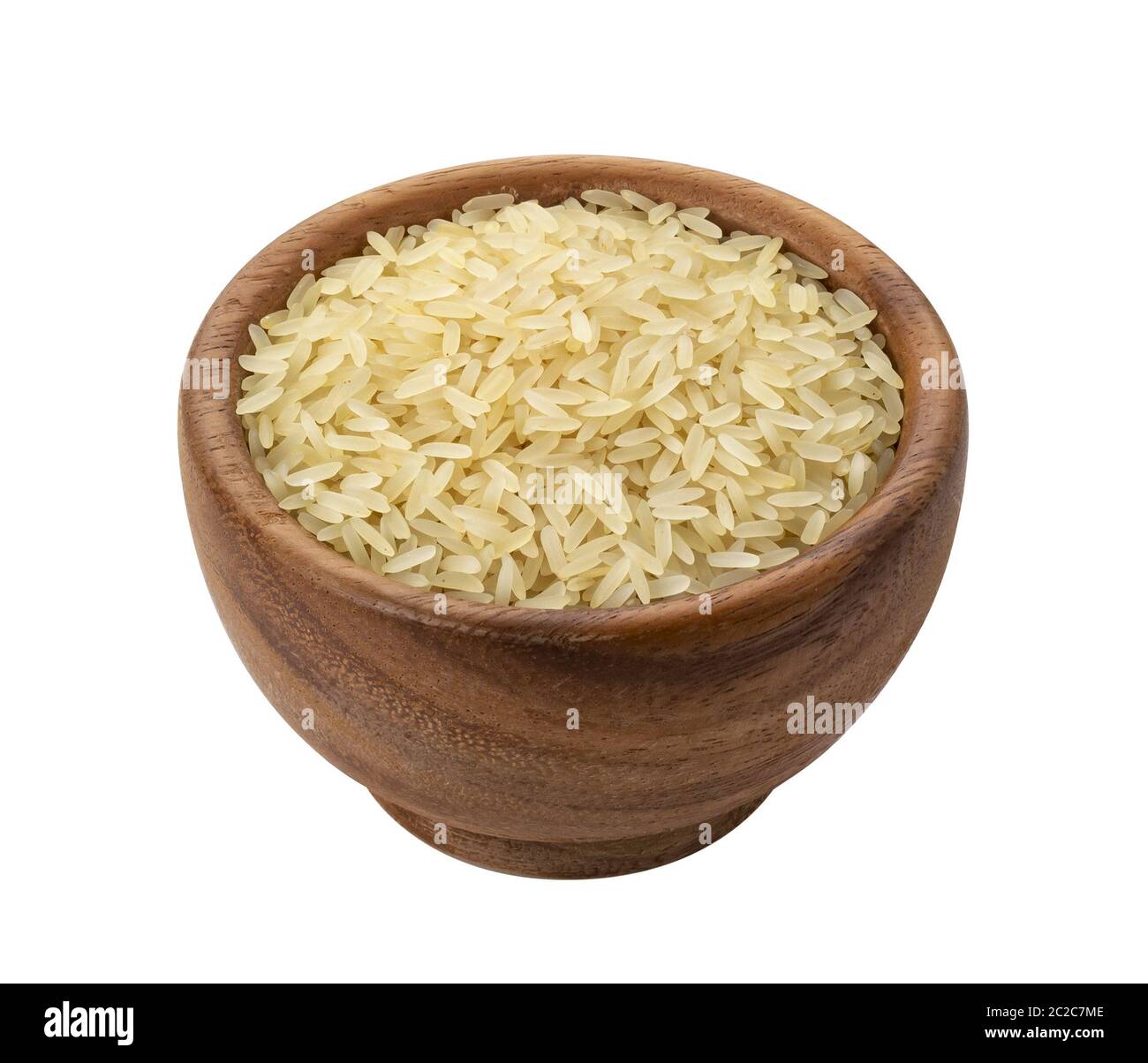 Braune Holzschale mit trockenen ungekocht parboiled Reis Getreide Stockfoto