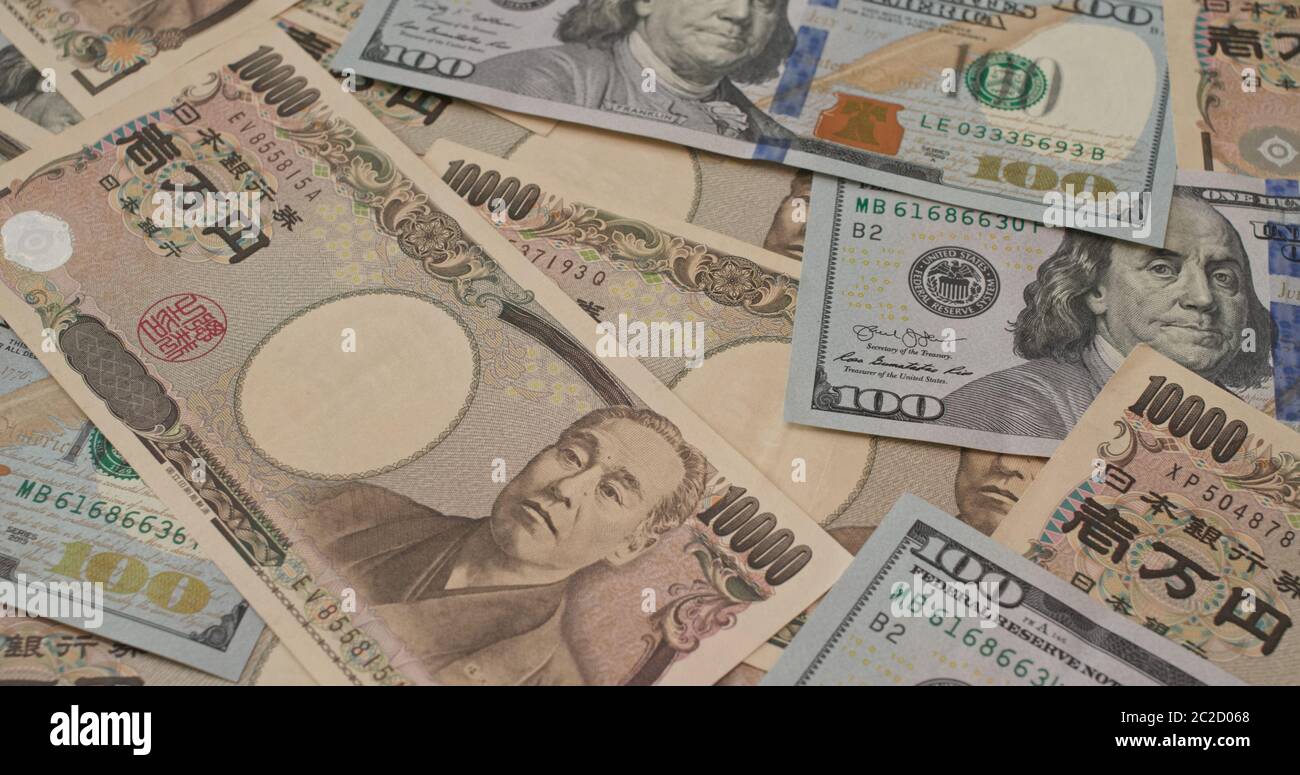 Stapel von amerikanischem USD und japanischem Yen Stockfoto