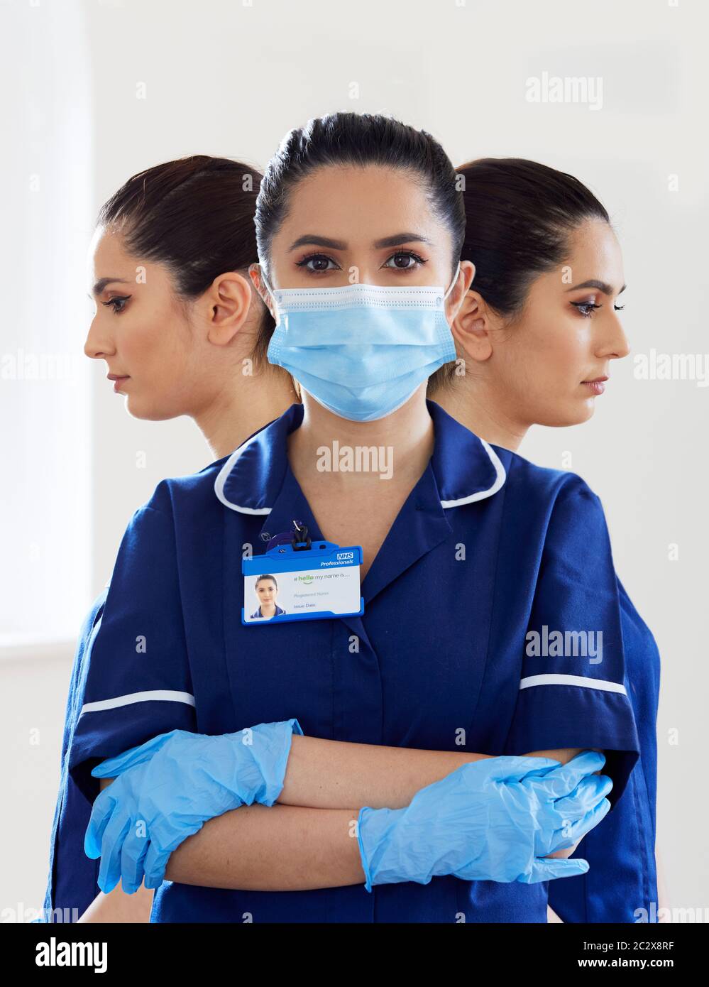 Portrait der Krankenschwester trägt PSA Maske und Handschuhe Stockfoto