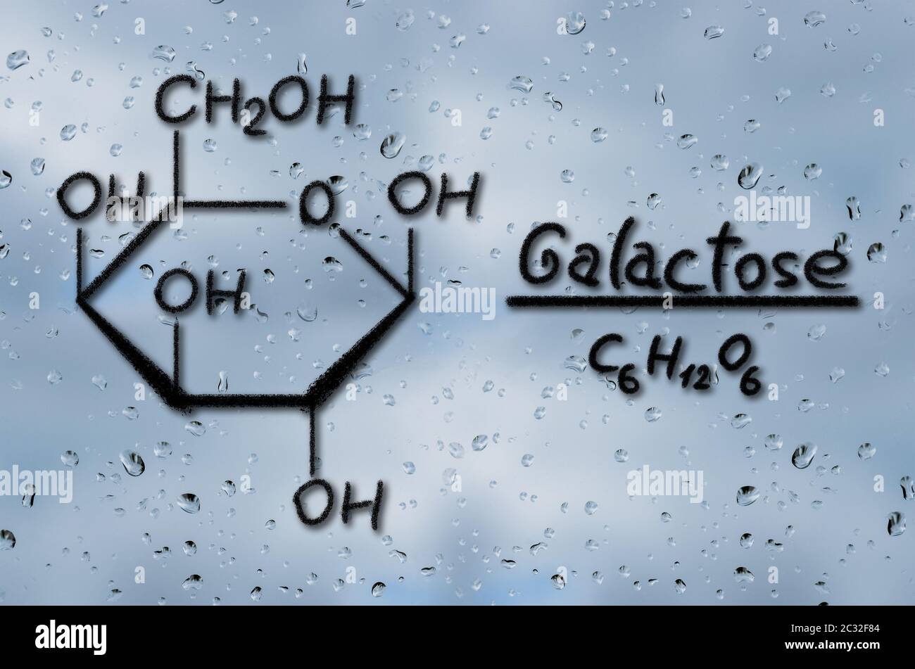 Strukturelle Modell der Galaktose auf dem Glas mit Regentropfen gezeichnet Stockfoto