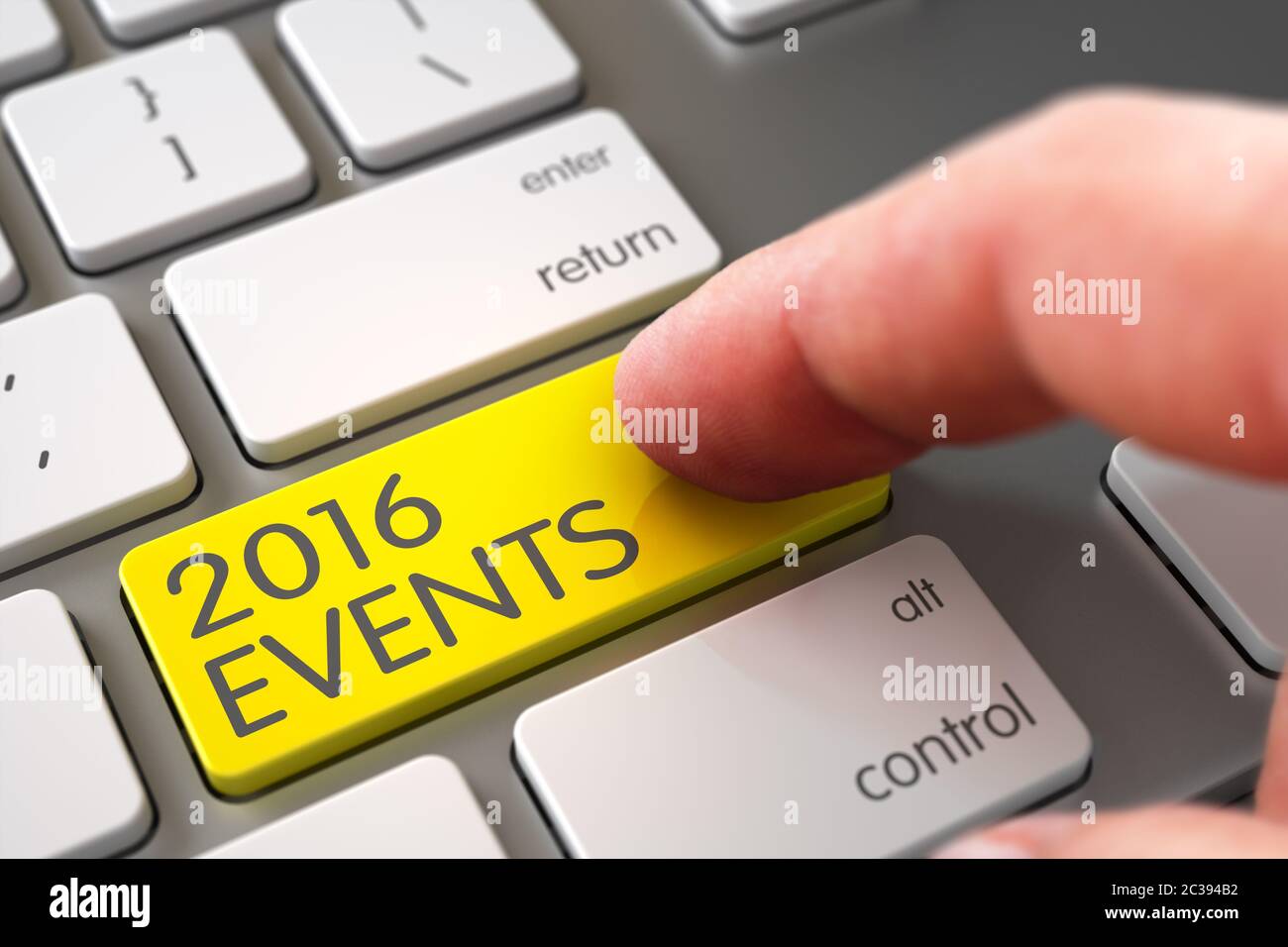 Mann Finger Drücken 2016 Ereignisse gelbe Taste auf Computer-Tastatur. 2016 Veranstaltungen - Computer Keyboard Konzept. Hand des jungen Mannes auf 2016 Veranstaltungen Gelber Butto Stockfoto