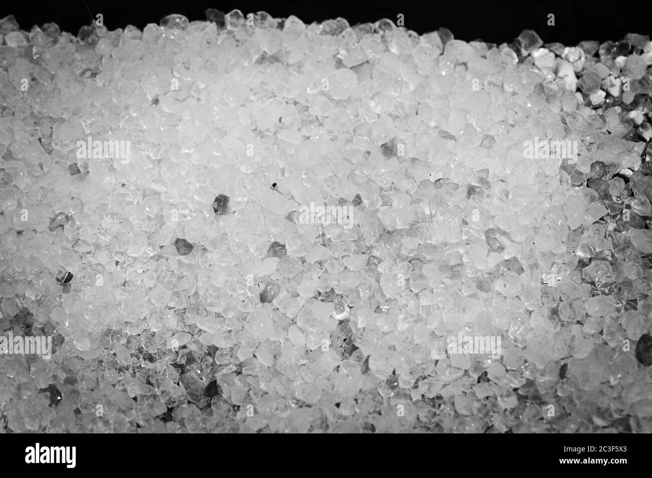 Hintergrundbild durch die Textur von einigen Steinen in schwarz und weiß gebildet Stockfoto