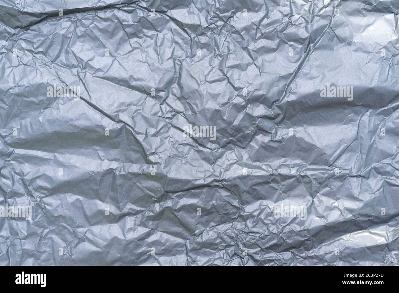 Faltiges graues Papier. Abstrakter Hintergrund. Grauer Hintergrund Stockfoto