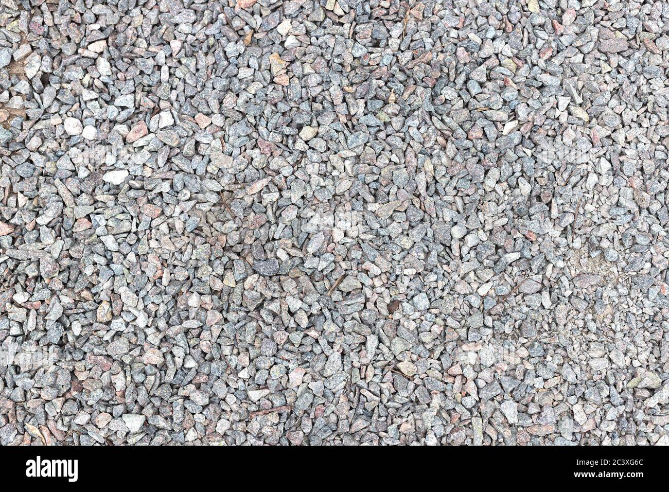 Textur von Ballast von gebrochenem Stein, Spangen, Macadam, Geröll. Hintergrund, Draufsicht. Stockfoto