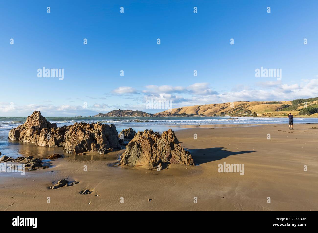 Neuseeland, Felsformationen am Sandstrand von Nugget Point Stockfoto