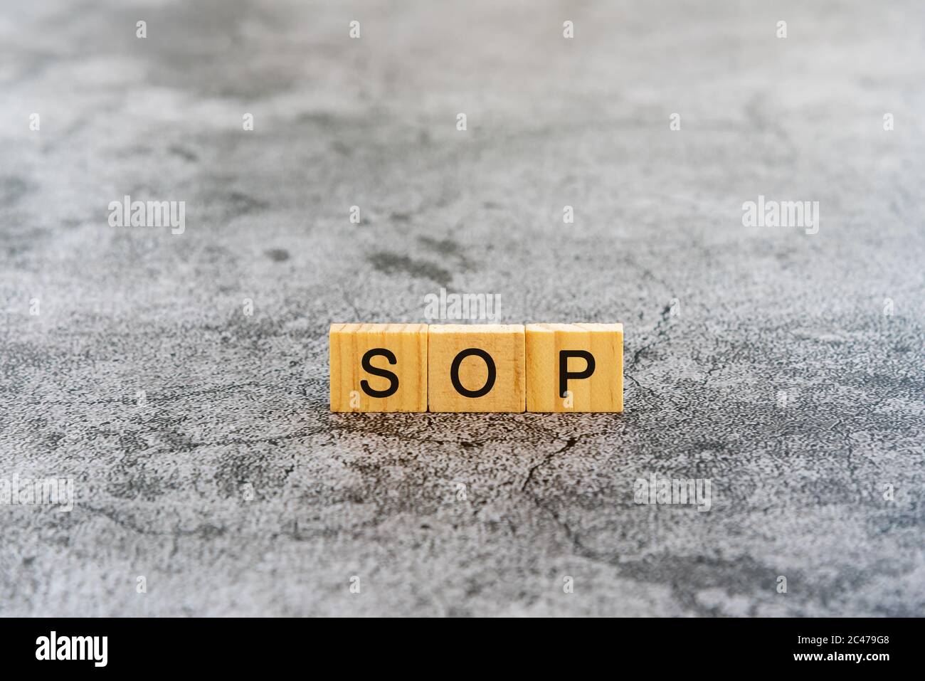 SOP (Standard Operating Procedure) Text auf Holzblock Texturen Hintergrund Stockfoto