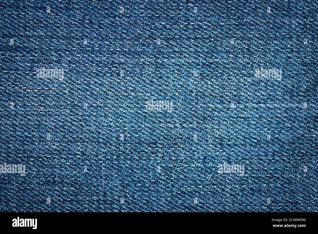 Nahansicht einer blauen Jeanstein Washed jean Textur Stockfoto