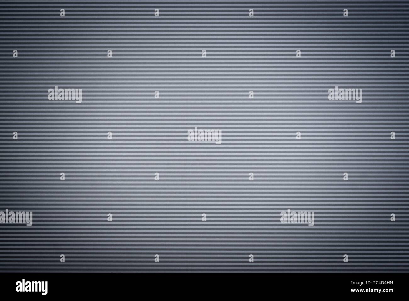 Grau gewellte Metallblech Wand Hintergrund mit schönen Scheinwerfer Vignette Stockfoto