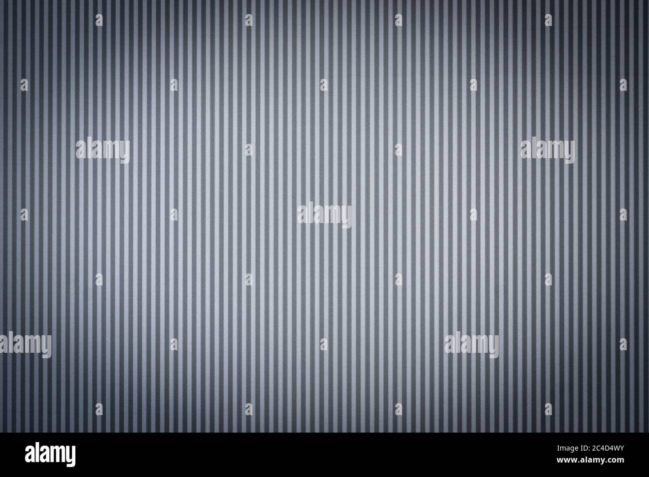 Grau gewellte Metallblech Wand Hintergrund mit schönen Scheinwerfer Vignette Stockfoto