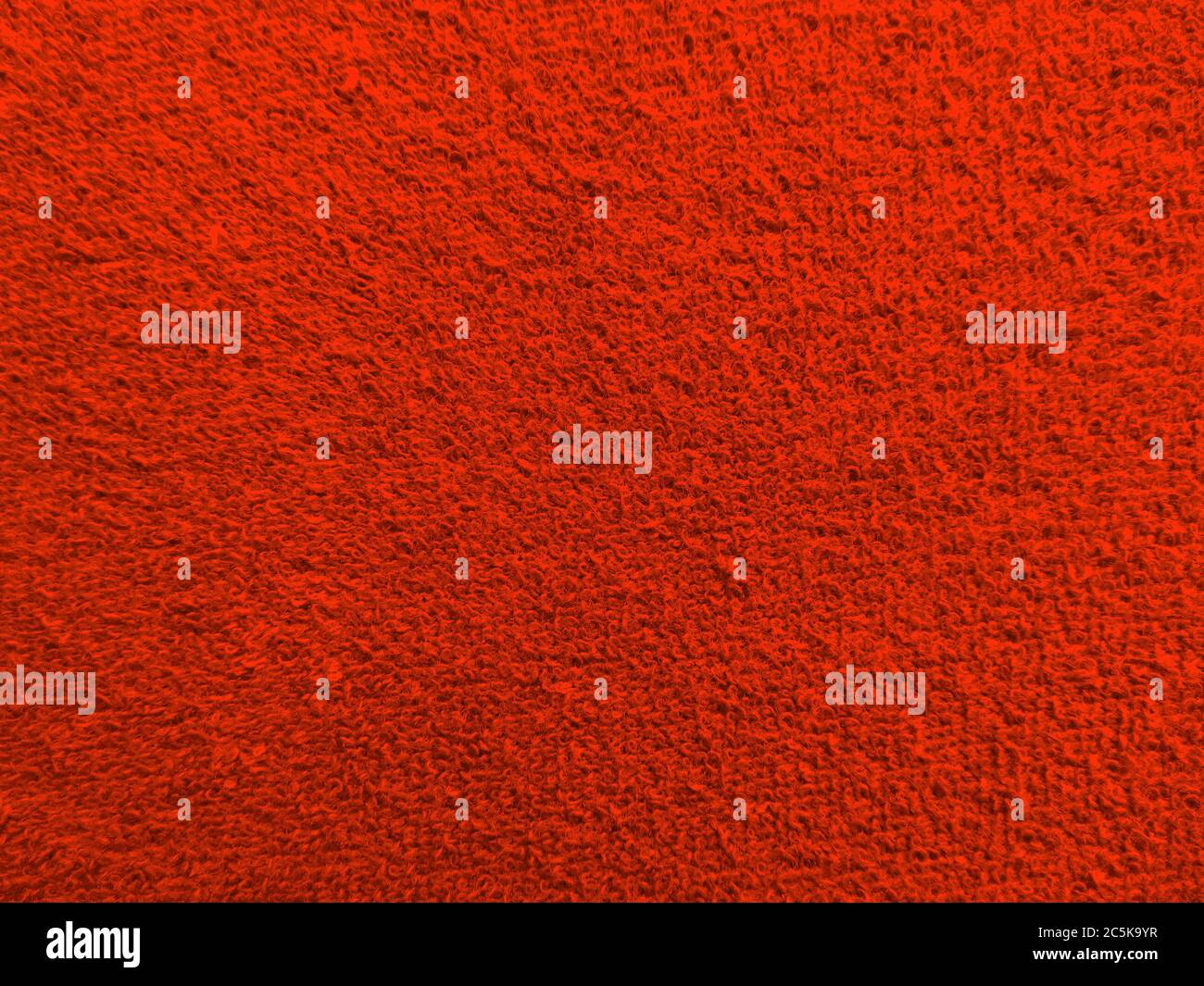 Textur aus rotem Frottee Nahaufnahme Stockfoto