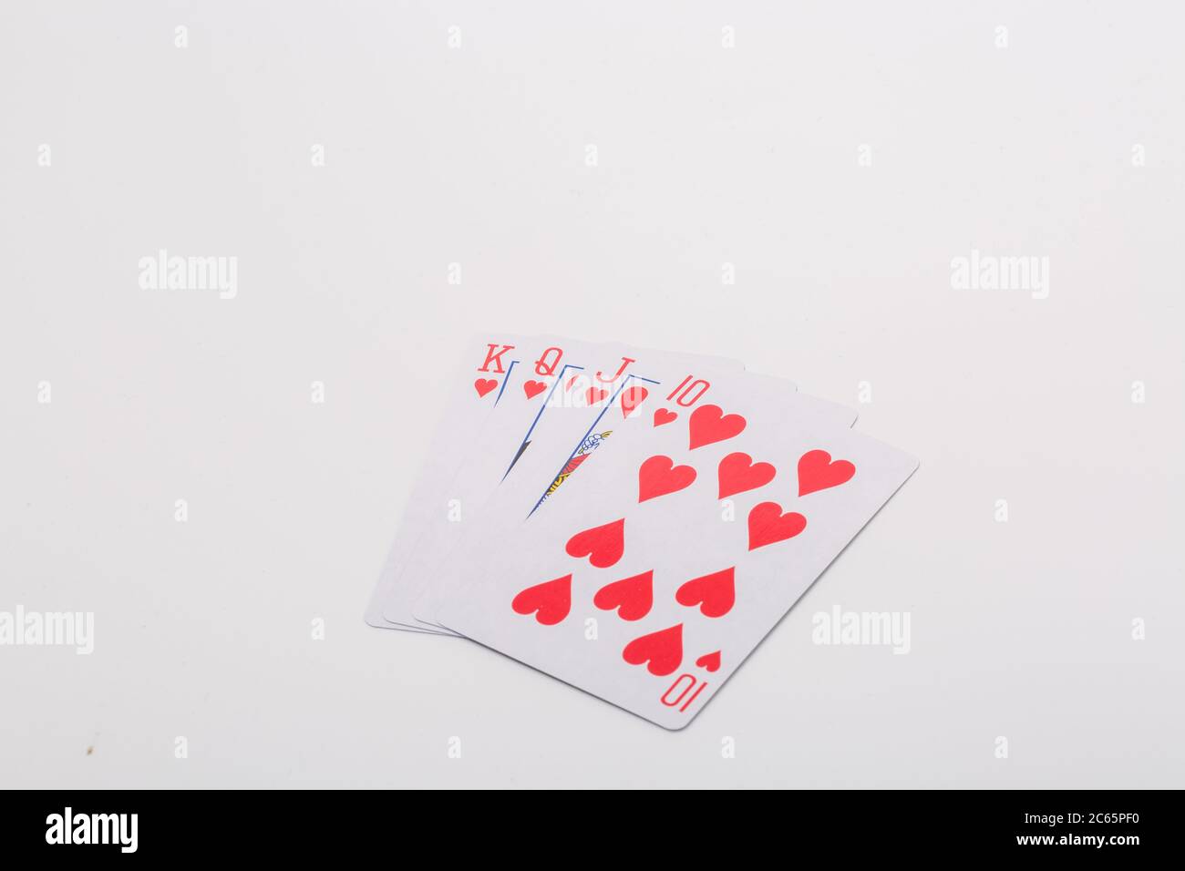 Erweiterte Spielkarten auf weißem Hintergrund Stockfoto