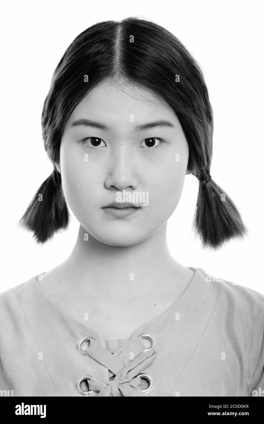 Gesicht der jungen schöne asiatische Frau mit Anschlusslitzen Stockfoto