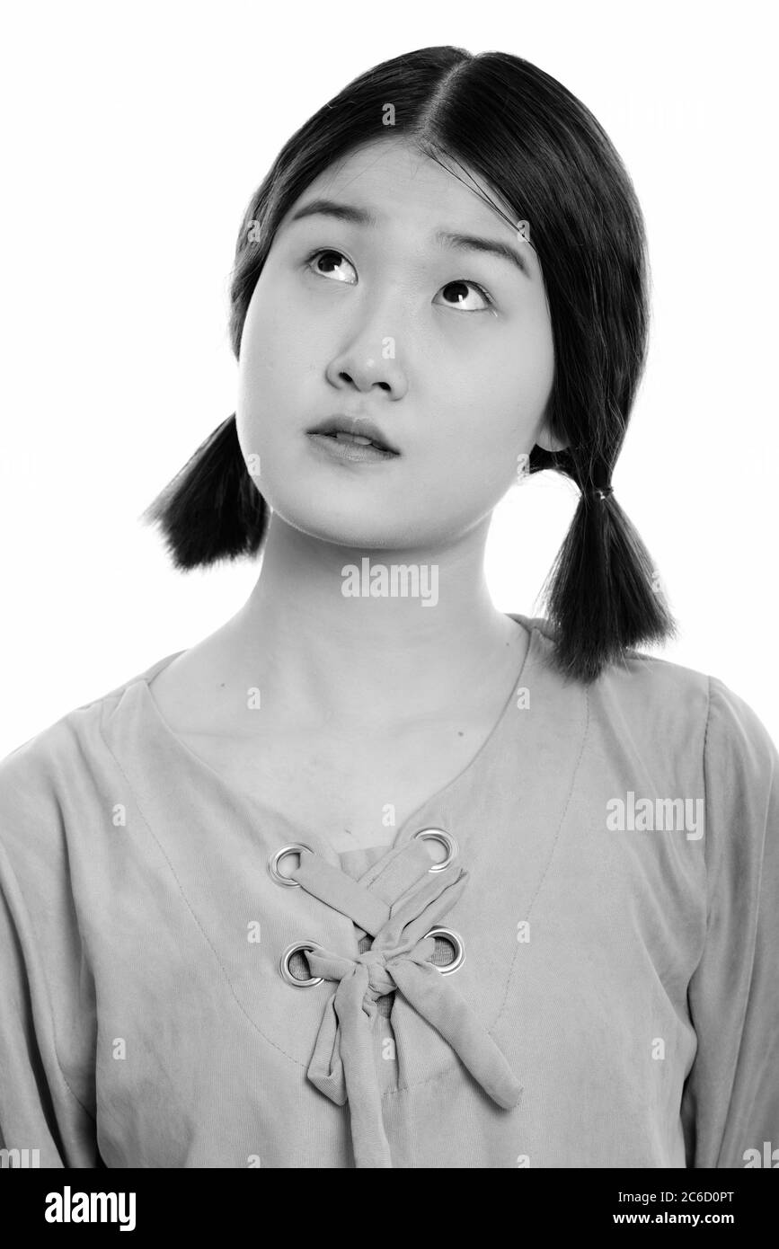 Gesicht der jungen schönen asiatischen Frau denken Stockfoto