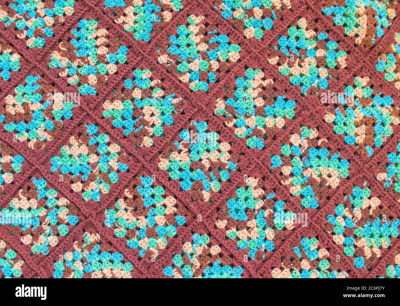 Hintergrund Textur-Nahaufnahme eines bunten Vintage handgefertigten afghanischen Quilt Stockfoto