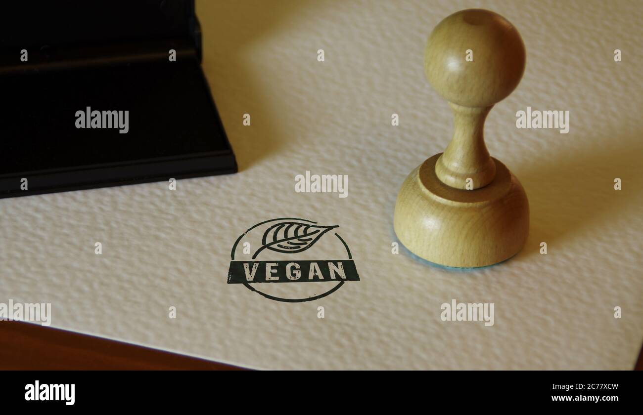 Vegane Stempel und Stempelhand. Lebensstil, Ökologie, Bio, Bio-Lebensmittel, vegetarische und natürliche gesunde Ernährung Konzept. Stockfoto