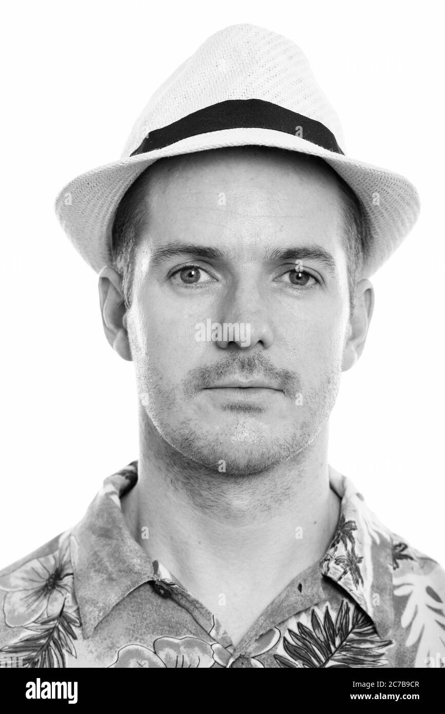 Angesichts der Mann mit Hawaiian Shirt und Hut bereit für Ferienhäuser Stockfoto Angesichts der Mann mit Hawaiian Shirt und Hut bereit für Ferienhäuser Stockfoto