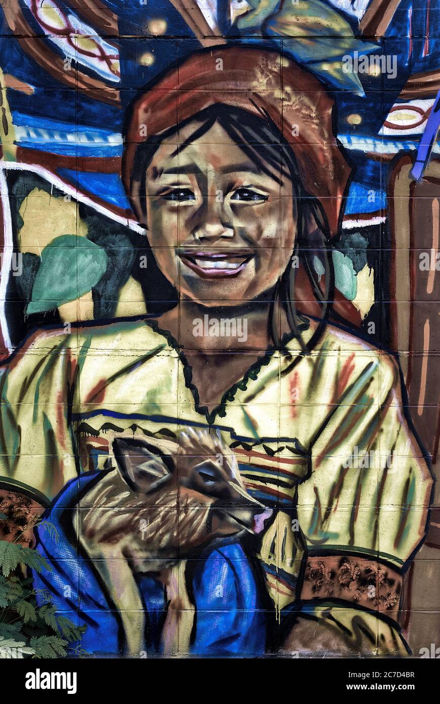 Graffiti. Bunte Wandkunst. Burmesisches Kind in traditioneller Tracht Stockfoto