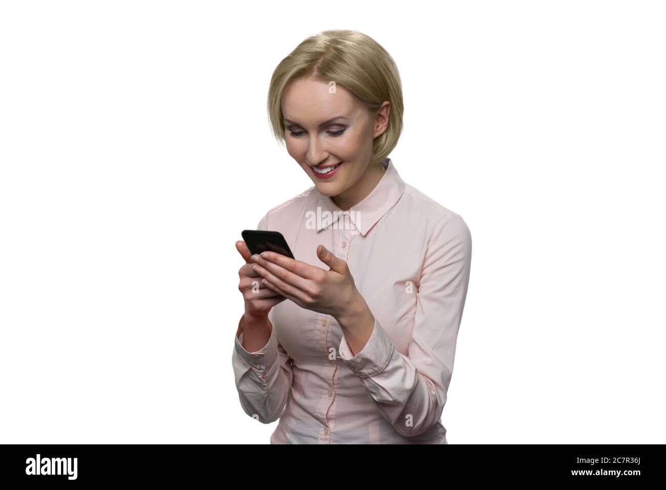 Glückliche reife Frau mit Telefon. Stockfoto