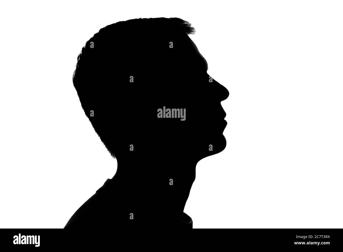 Porträt eines jungen Mannes, Seitenansicht - dunkle Silhouette Stockfoto