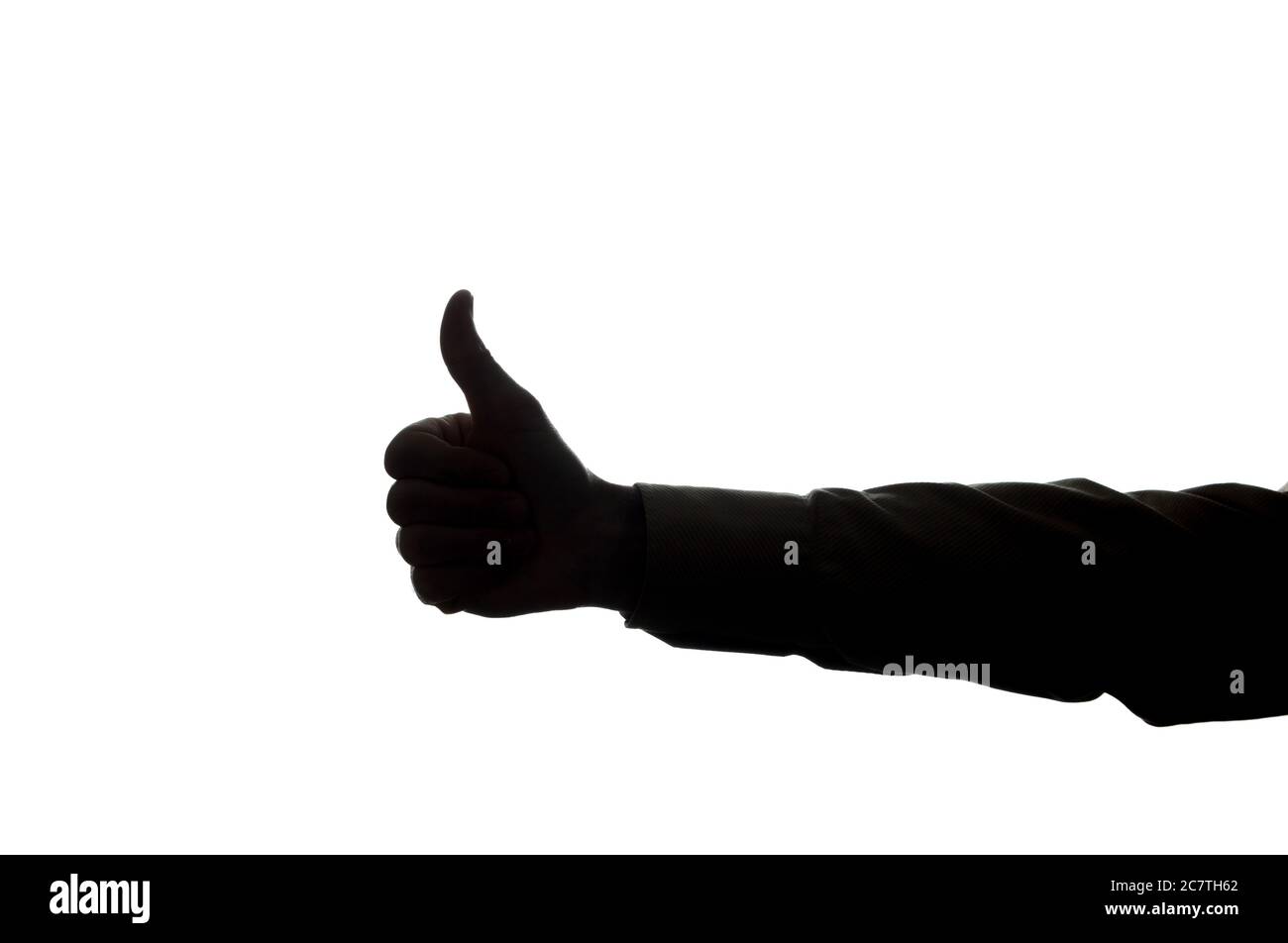 Die Hand des Mannes zeigt ein Symbol einer ok - Silhouette Stockfoto