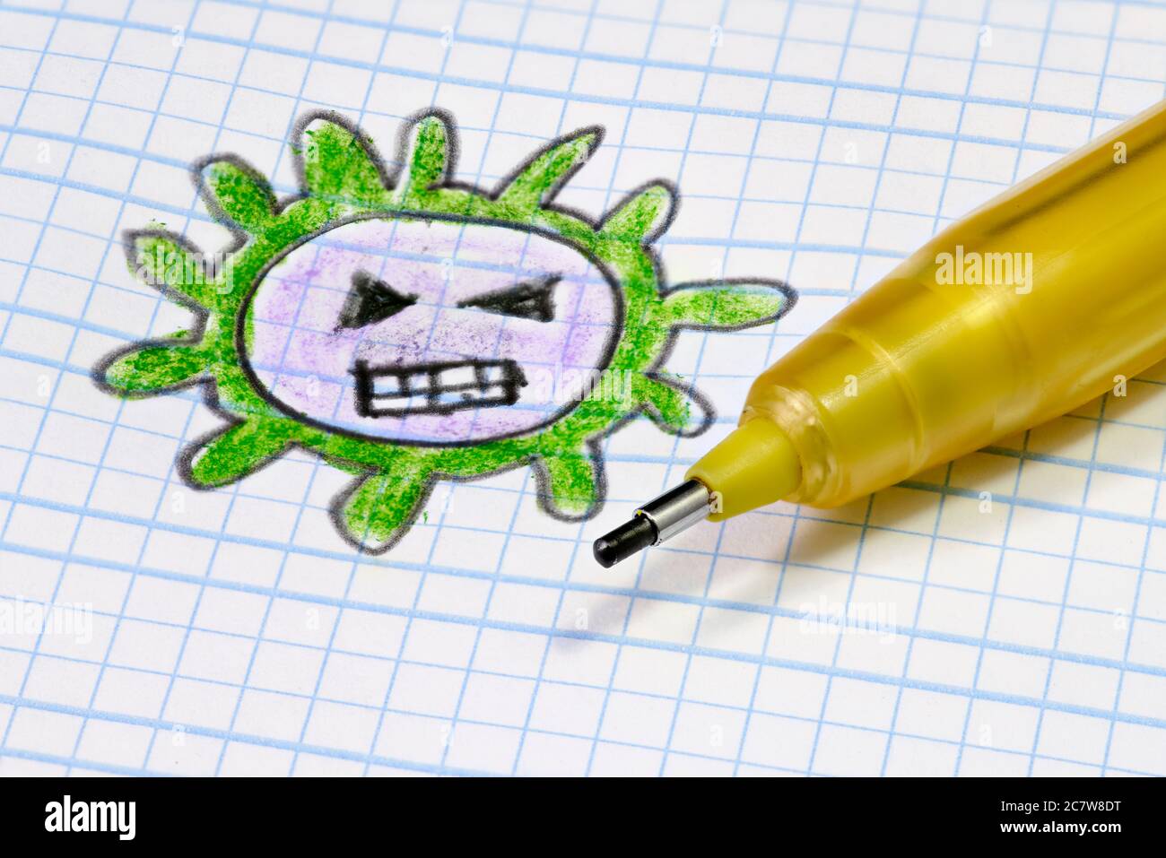 Covid Virus (orthocoronavirinae) gezeichnet mit Buntstiften auf einem Schulbuch Stockfoto