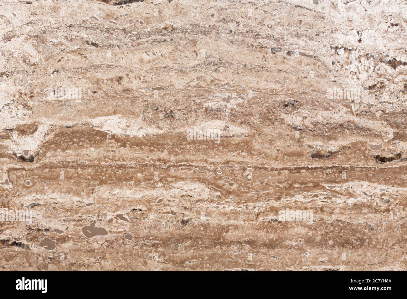 Oberfläche von Travertin Stein in Nahaufnahme. Abstrakte Textur. Stockfoto