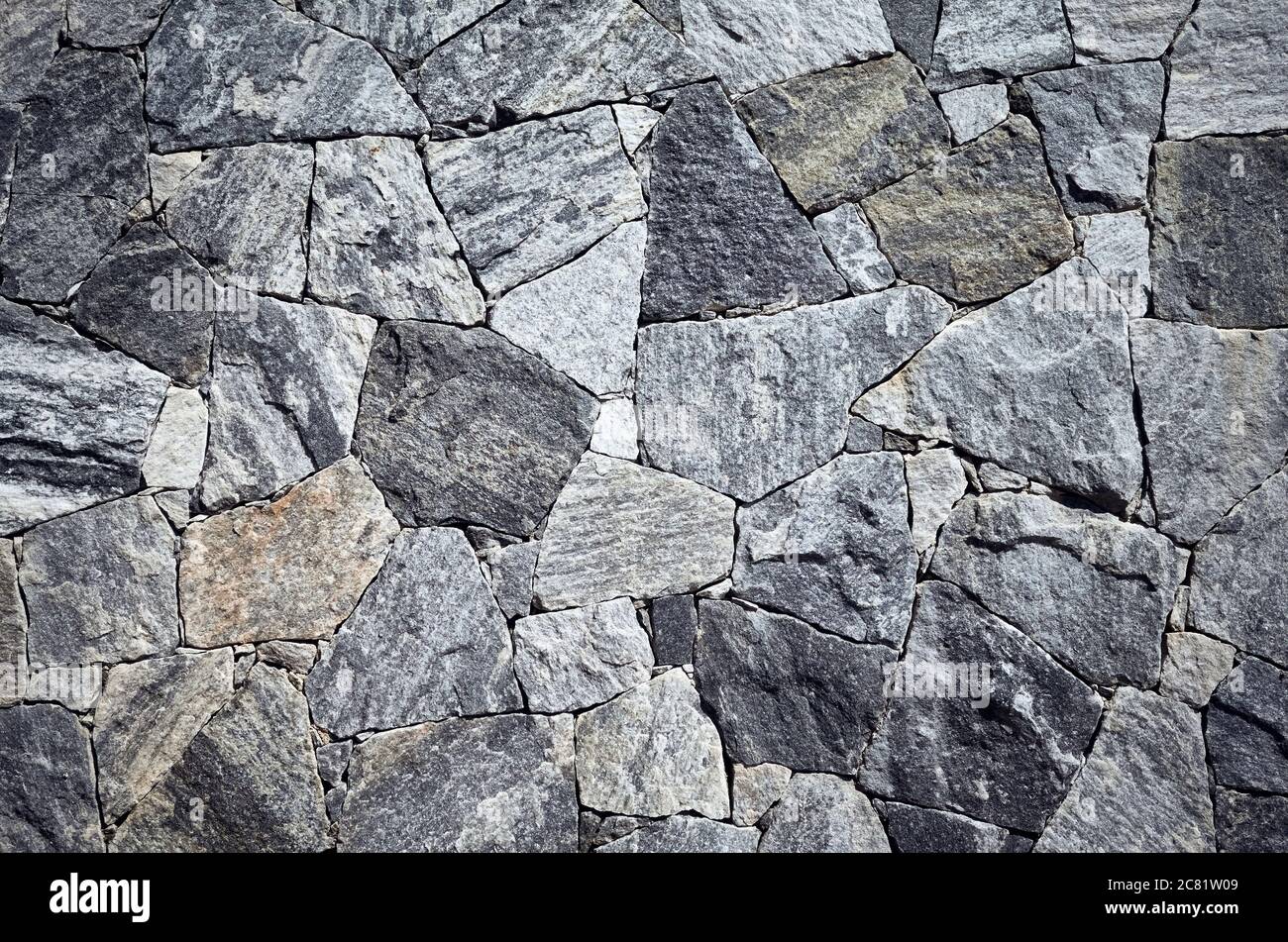 Tapete aus Marmor Stücke in verschiedenen Formen und Größen, raue Oberflächenstruktur oder Hintergrund. Stockfoto