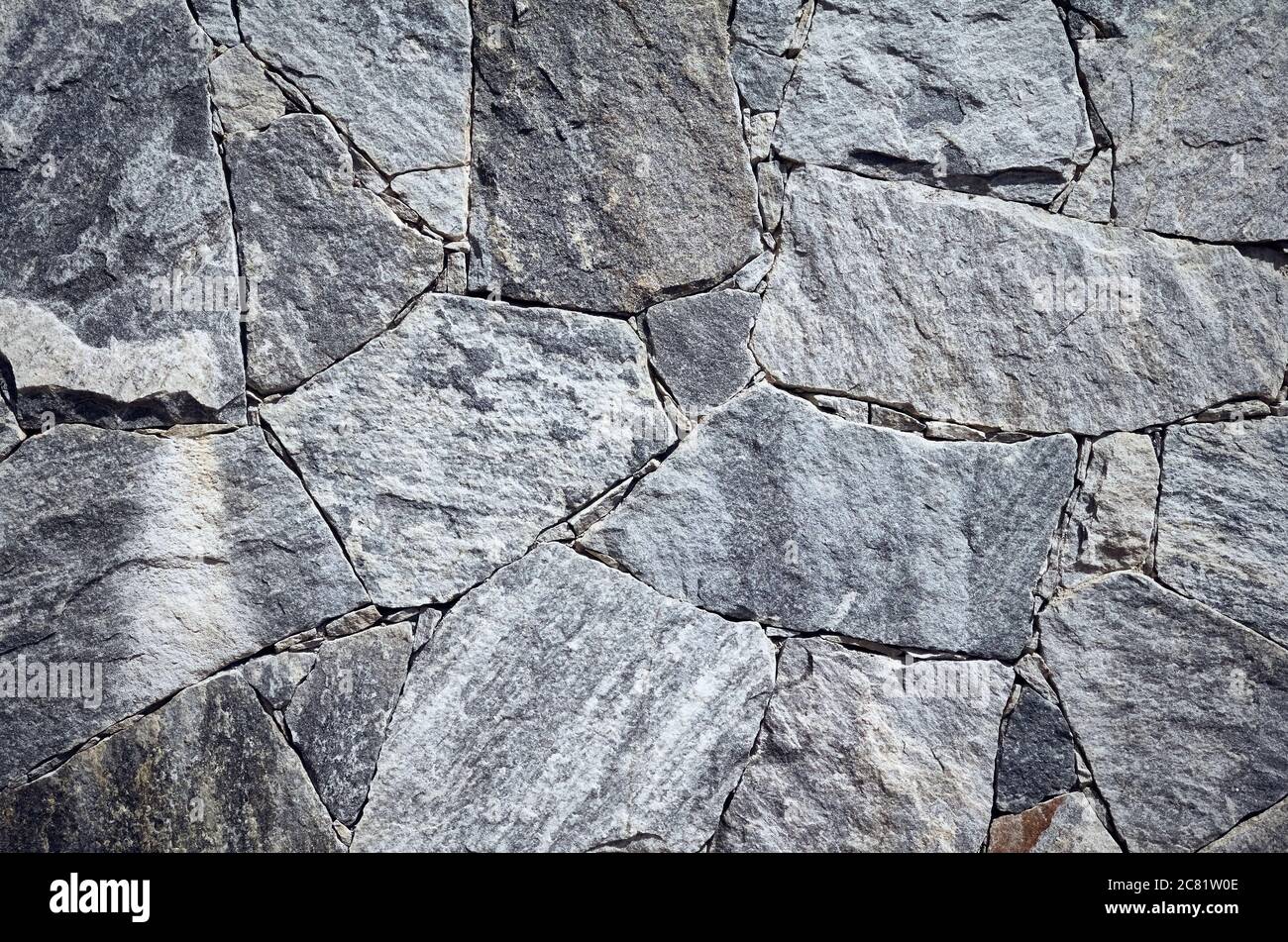 Tapete aus Marmor Stücke in verschiedenen Formen und Größen, raue Oberflächenstruktur oder Hintergrund. Stockfoto