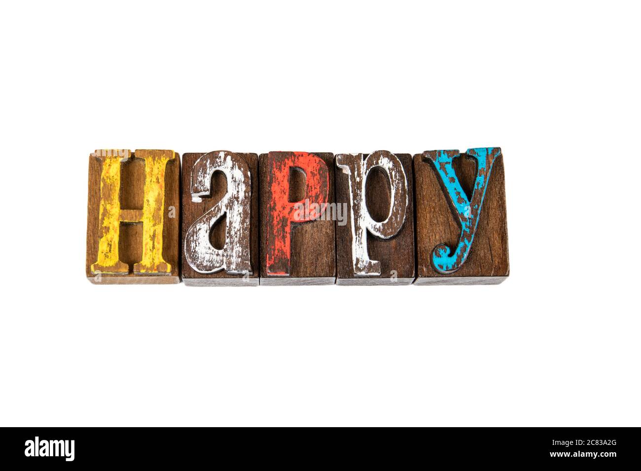 GLÜCKLICH. Gefühle, Stress, Psychologie und Zufriedenheit Konzept. Farbige Holzbuchstaben auf weißem Hintergrund Stockfoto