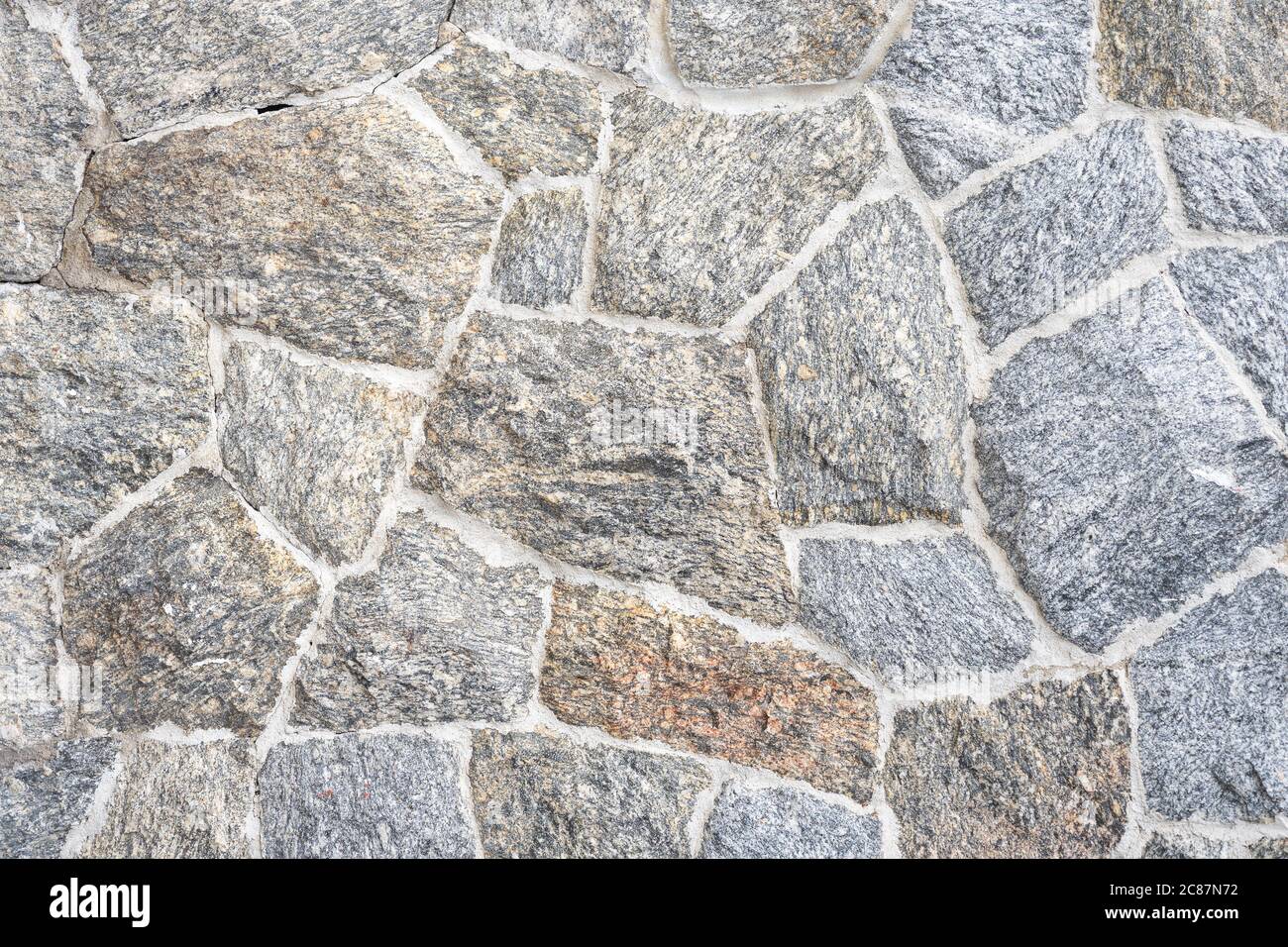 Nahaufnahme Teil einer Steinwand rustikalen Grunge nahtlose Textur Hintergrund Stockfoto