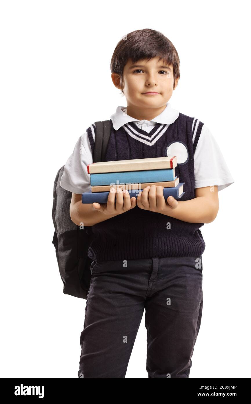 Schuljunge mit einem Rucksack hält einen Stapel von Büchern isoliert auf weißem Hintergrund Stockfoto