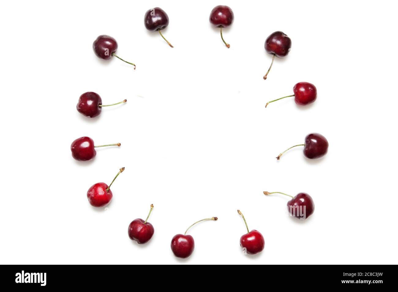 Kreis Uhr mit Kirschen Stockfoto