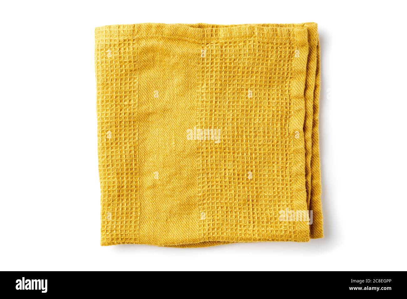 Gefaltete gelbe Textilserviette auf weiß Stockfoto