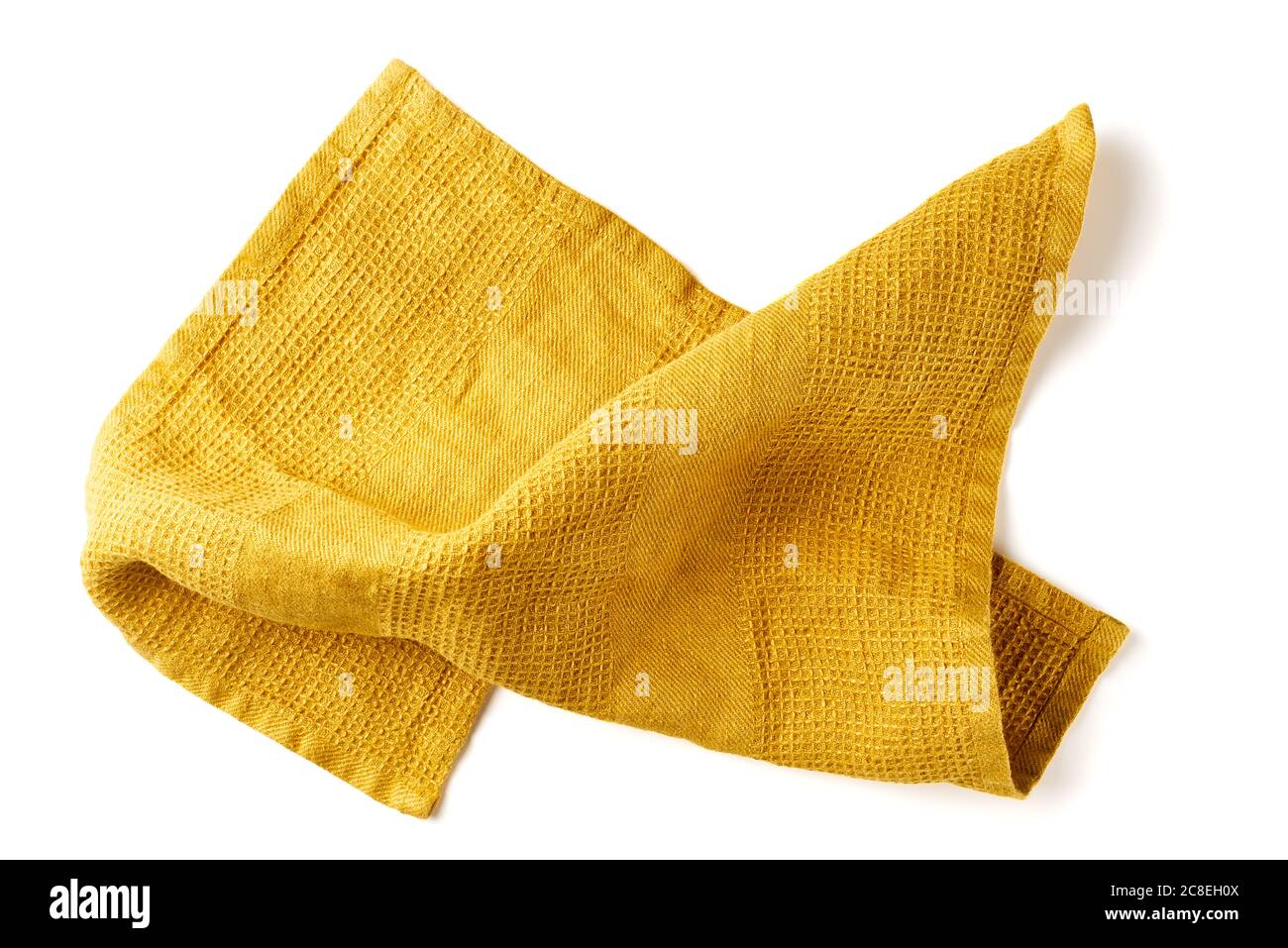 Gelbverkrümmte Stoffserviette auf weiß Stockfoto