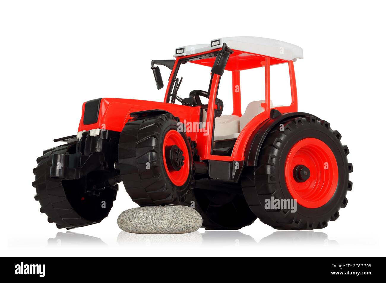 Kunststoff Spielzeug Traktor isoliert auf weißem Hintergrund Stockfoto