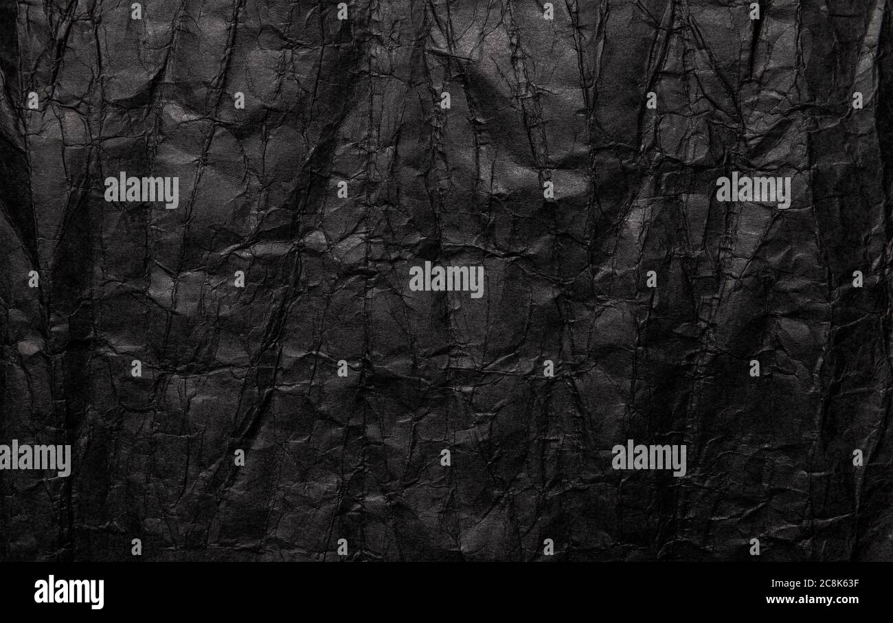 Schwarze zerknitterte Papiertextur, grunge Hintergrund Stockfoto