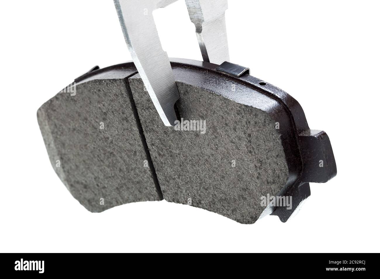 Bremsbeläge, Messung durch einen Bremssattel der Dicke Auto-Ersatzteil, isoliert niemand. Stockfoto