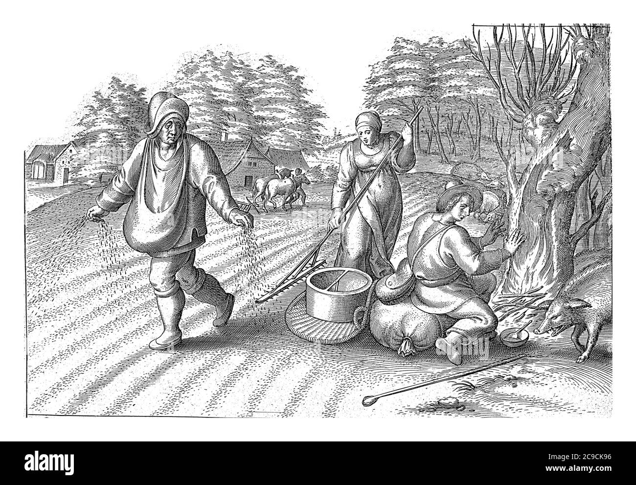 Auf dem Feld sät, besprengt EIN Mann sein Feld mit Samen. Eine Frau reckt die Samen in den Boden. Ein anderer Mann erwärmt sich auf einem Feuer unter einem Baum, Stockfoto