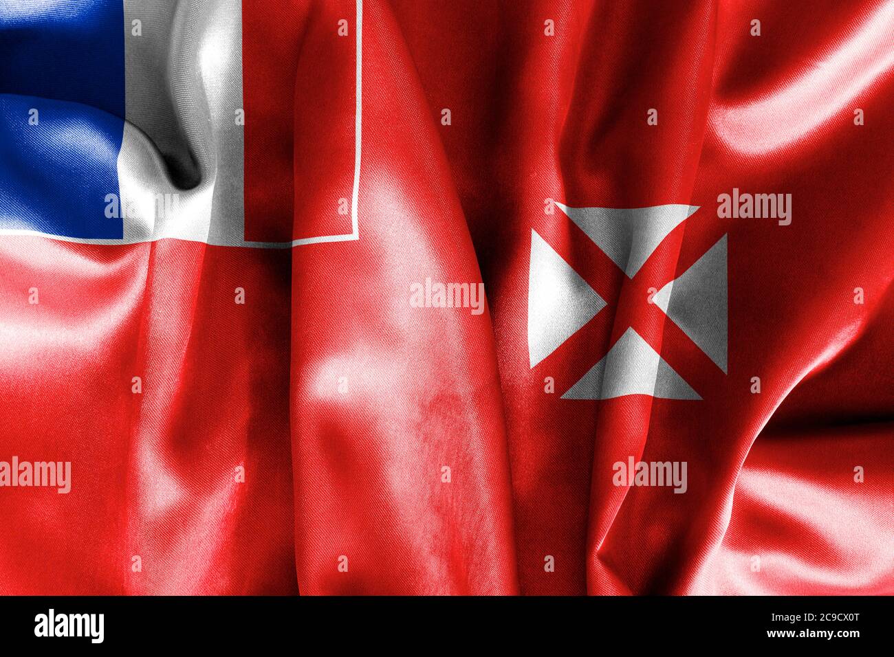 Wallis und Futuna Flagge knitterte und zerknitterte mit Licht und Schatten Stockfoto