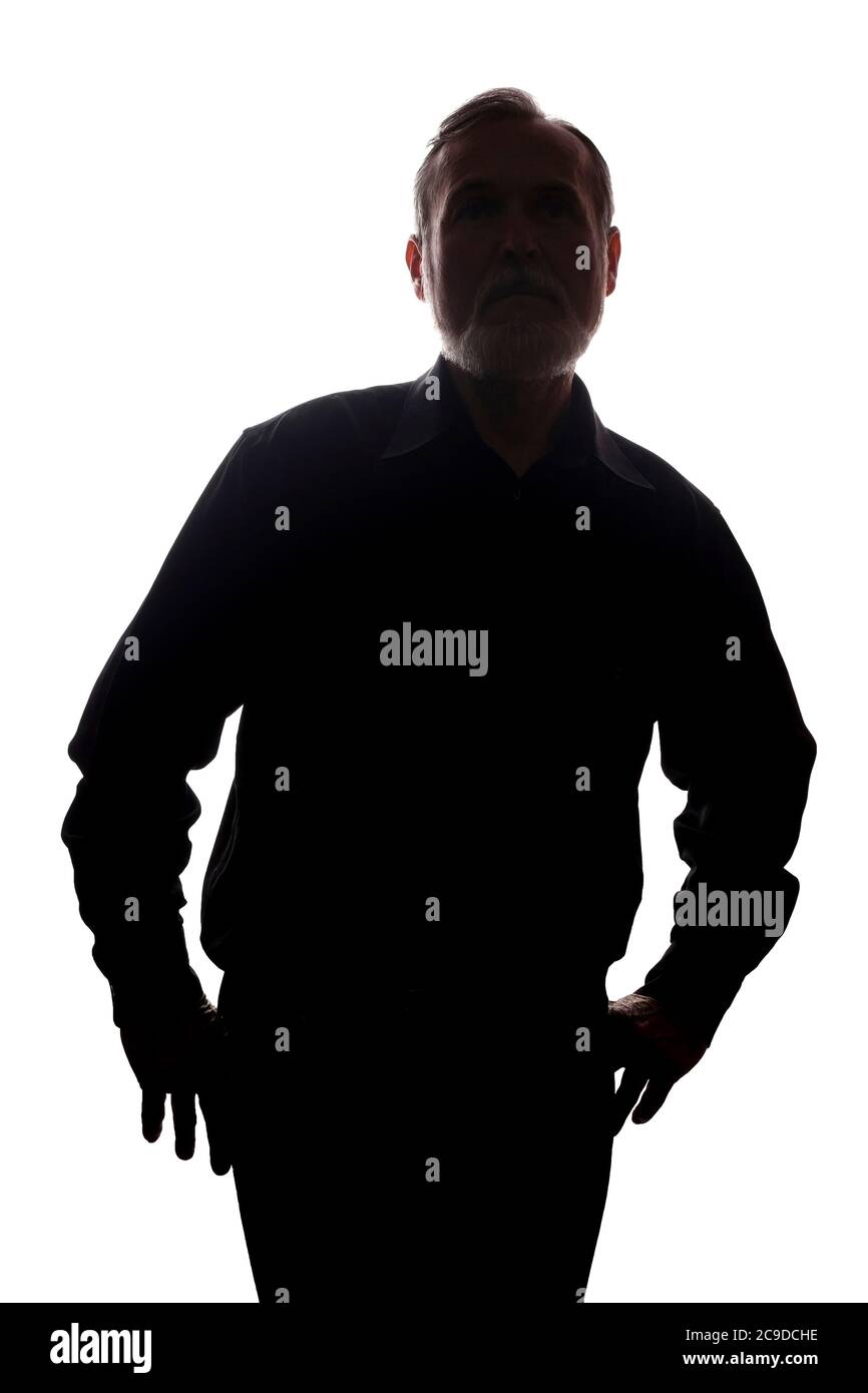 Porträt eines alten Mannes, unrasiert, mit Bart, Seitenansicht - dunkel isolierte Silhouette Stockfoto