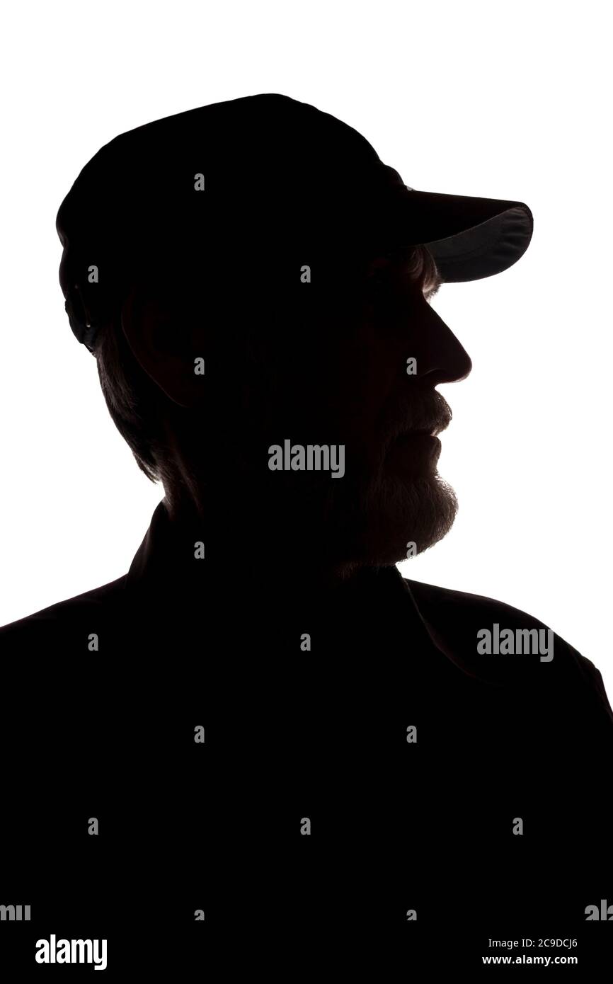 Porträt eines alten Mannes, in einer Spitzenmütze, mit Bart, Seitenansicht - dunkel isoliert Silhouette Stockfoto