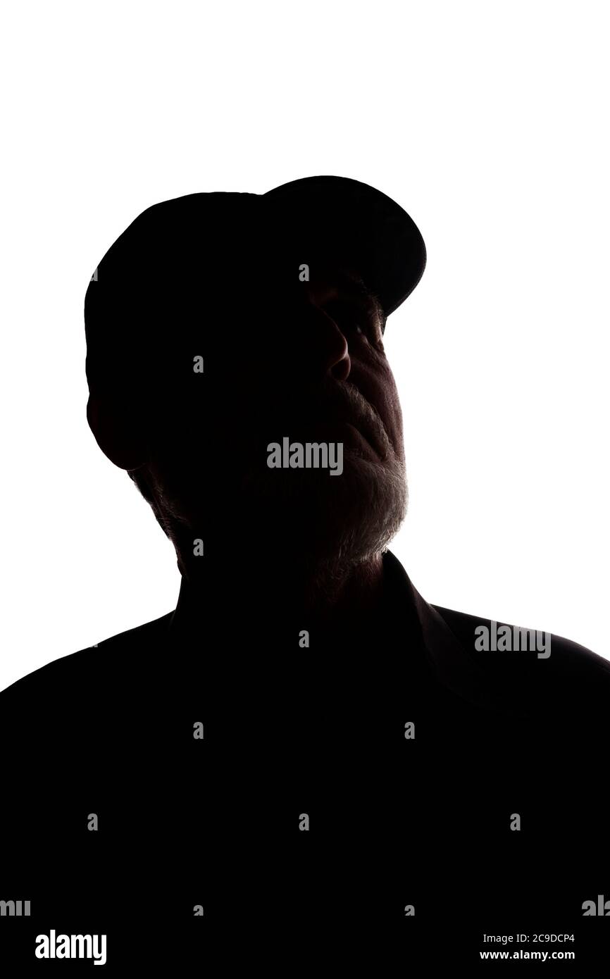 Porträt eines alten Mannes, in einer Spitzenmütze, mit Bart, Seitenansicht - dunkel isoliert Silhouette Stockfoto